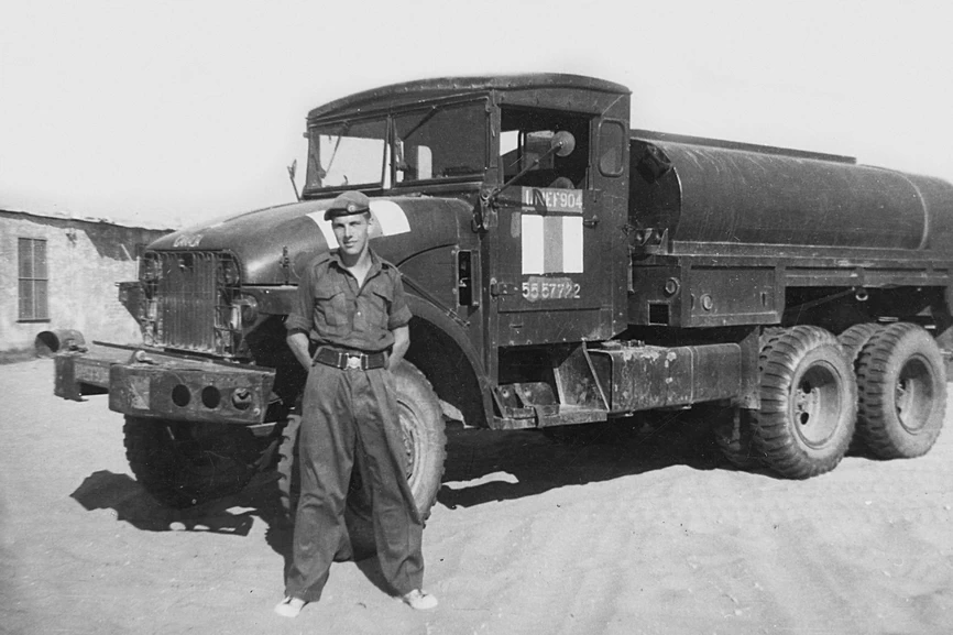 United Nations truck with driver John Paterson standing in front of it