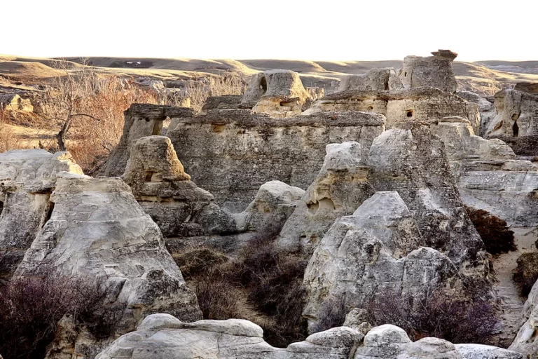 Sunsets last rays light the Hoodoos at Writing On Stone Park in Alberta
