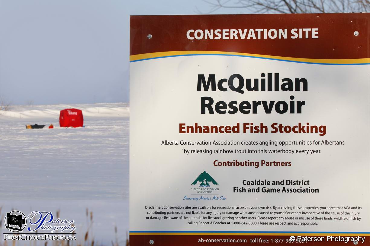 Ice fishing on McQuillan Lake Alberta